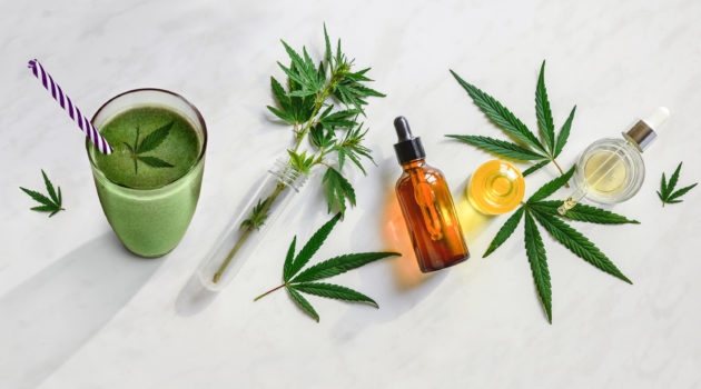 Concept Smoothie with cannabis and edible CBD. Glasses with fresh drinks, milk and smoothies, with hemp. 